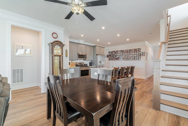 237 Ridgeline Dr, Waynesboro, VA 22980 - dining area with a ceiling fan, baseboards, stairs, ornamental molding, and light wood-style floors