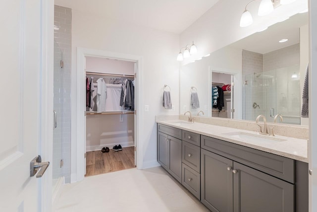 237 Ridgeline Dr, Waynesboro, VA 22980 - full bath with a spacious closet, double vanity, a shower stall, and baseboards