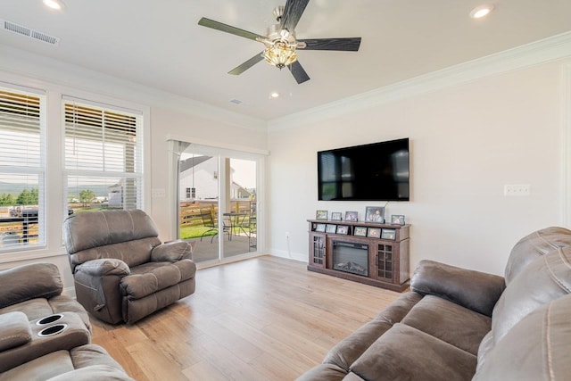 237 Ridgeline Dr, Waynesboro, VA 22980 - living room featuring a ceiling fan, light wood-type flooring, ornamental molding, recessed lighting, and a glass covered fireplace