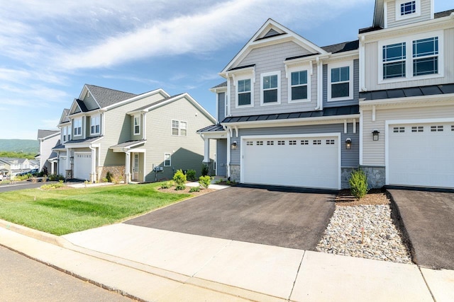 237 Ridgeline Dr, Waynesboro, VA 22980 - multi unit property featuring stone siding, a standing seam roof, a residential view, and asphalt driveway