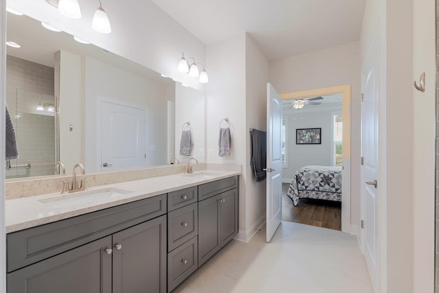 237 Ridgeline Dr, Waynesboro, VA 22980 - ensuite bathroom with double vanity, a ceiling fan, tile patterned floors, and baseboards