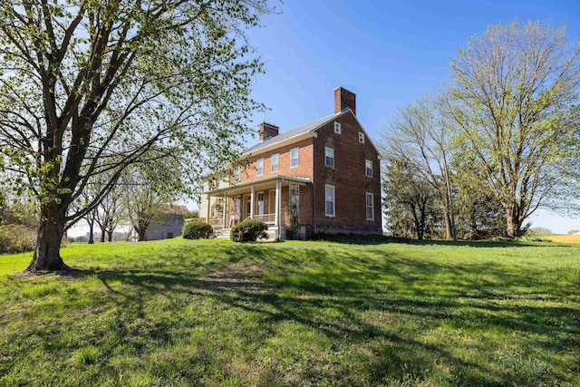 3599 Lumber Mill Rd, Dayton, VA 22821 - view of side of property featuring a chimney, a lawn, and brick siding
