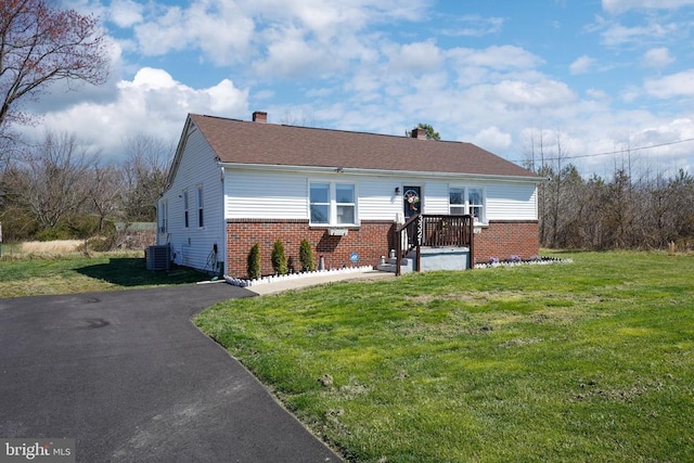 3321 Summit Crossing Rd, Fredericksburg, VA 22408 - bungalow featuring brick siding, a front lawn, and a chimney