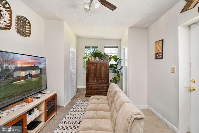3321 Summit Crossing Rd, Fredericksburg, VA 22408 - living area featuring light colored carpet, a ceiling fan, and a textured ceiling