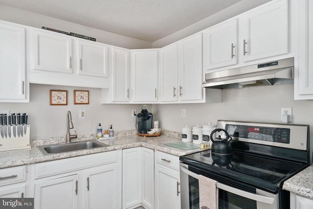 3321 Summit Crossing Rd, Fredericksburg, VA 22408 - kitchen with stainless steel range with electric stovetop, under cabinet range hood, white cabinets, and a textured ceiling