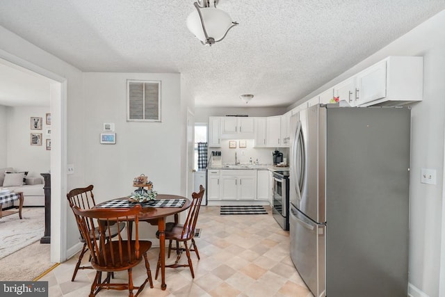 3321 Summit Crossing Rd, Fredericksburg, VA 22408 - dining room with a textured ceiling and light flooring