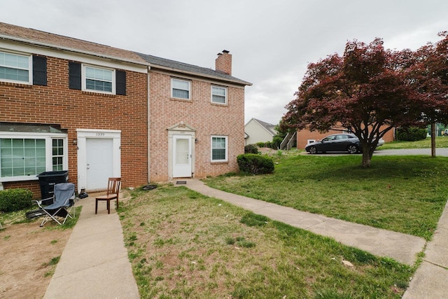 1331 Devon Ln, Harrisonburg, VA 22801 - view of property with a chimney, a front lawn, and brick siding