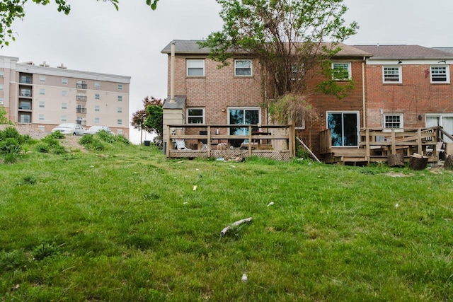 1331 Devon Ln, Harrisonburg, VA 22801 - rear view of house featuring a wooden deck, brick siding, and a lawn