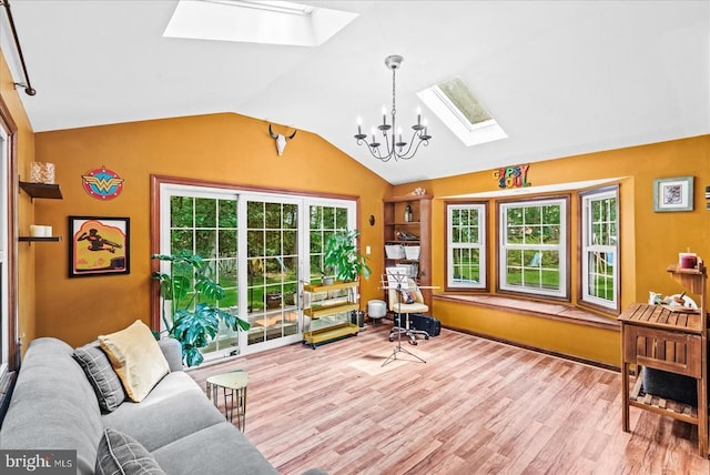 11311 Crown Ct, Fredericksburg, VA 22407 - living area featuring a skylight, wood finished floors, vaulted ceiling, and a chandelier