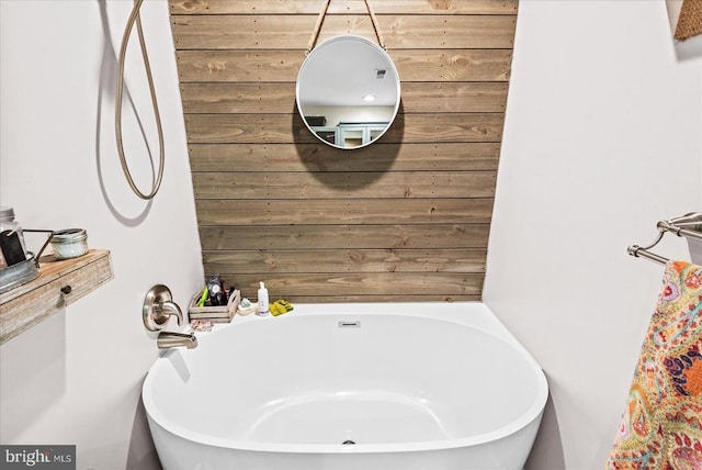 11311 Crown Ct, Fredericksburg, VA 22407 - bathroom featuring a tub and wooden walls