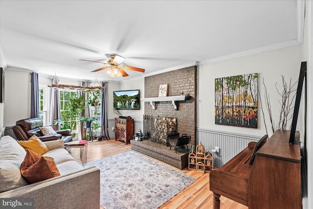 11311 Crown Ct, Fredericksburg, VA 22407 - living room with ornamental molding, wood finished floors, ceiling fan, and a wainscoted wall