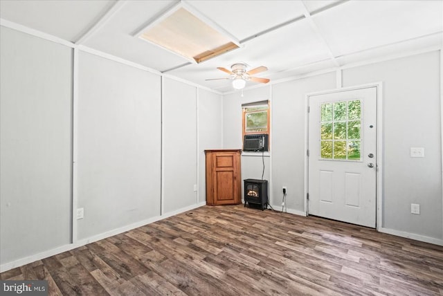 11311 Crown Ct, Fredericksburg, VA 22407 - empty room featuring a wood stove, wood finished floors, and ceiling fan