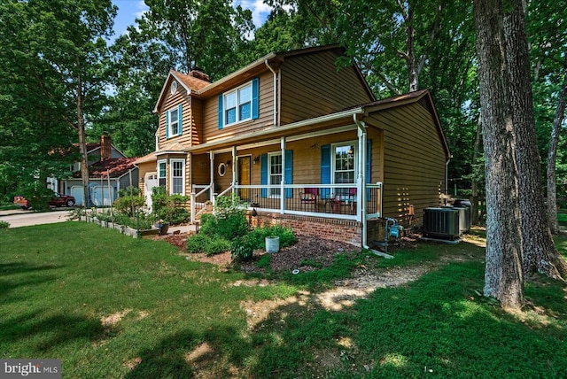 11311 Crown Ct, Fredericksburg, VA 22407 - view of front of home with covered porch, a front lawn, and concrete driveway