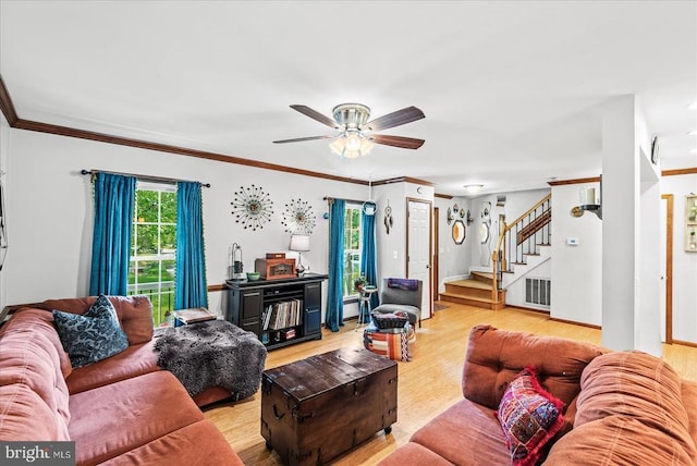 11311 Crown Ct, Fredericksburg, VA 22407 - living room with stairs, light wood finished floors, ceiling fan, and crown molding