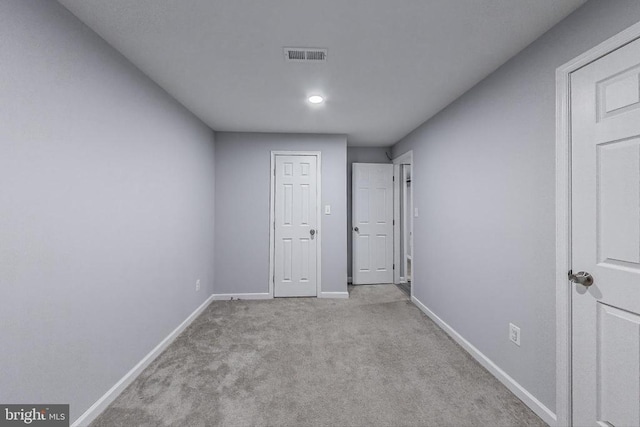  - unfurnished bedroom featuring carpet and recessed lighting