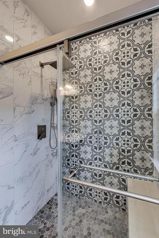  - full bathroom featuring a shower stall