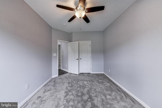  - unfurnished bedroom featuring carpet flooring and a ceiling fan