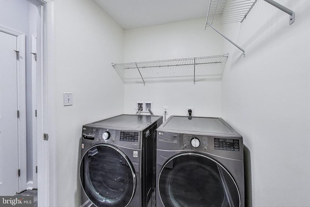  - washroom featuring washing machine and clothes dryer