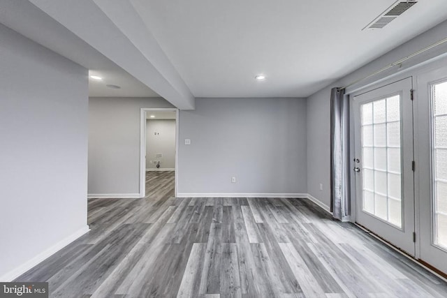  - empty room featuring wood finished floors and recessed lighting
