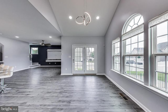  - unfurnished living room with lofted ceiling, dark wood-style flooring, a ceiling fan, and recessed lighting