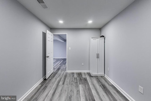  - spare room featuring wood finished floors and recessed lighting