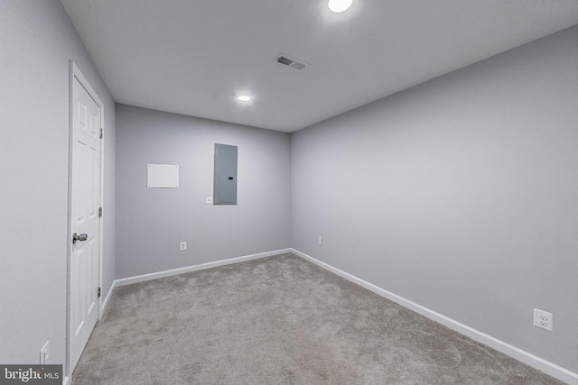  - unfurnished room with electric panel, carpet flooring, and recessed lighting