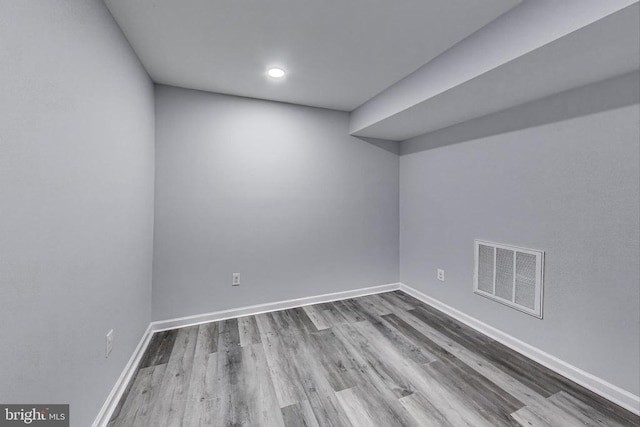  - unfurnished room with wood finished floors and recessed lighting