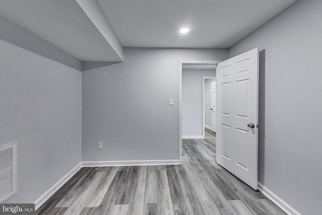  - empty room with wood finished floors and recessed lighting