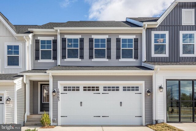 10628 Afton Grove Ct, Fredericksburg, VA 22408 - view of front of property with concrete driveway, board and batten siding, a shingled roof, and a garage