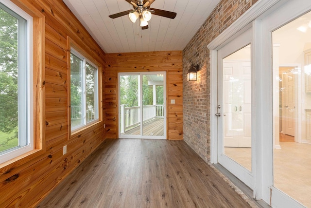 640 Greenwood St, Rockingham, VA 22801 - unfurnished sunroom with brick wall, wood finished floors, wooden walls, and wood ceiling