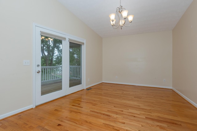 640 Greenwood St, Rockingham, VA 22801 - empty room featuring light wood finished floors, a chandelier, and baseboards