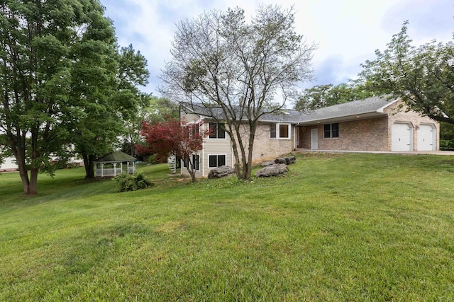 640 Greenwood St, Rockingham, VA 22801 - view of green lawn featuring an attached garage, a gazebo, and driveway