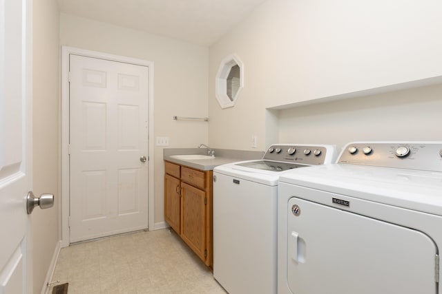 640 Greenwood St, Rockingham, VA 22801 - washroom with separate washer and dryer, light flooring, baseboards, and cabinet space