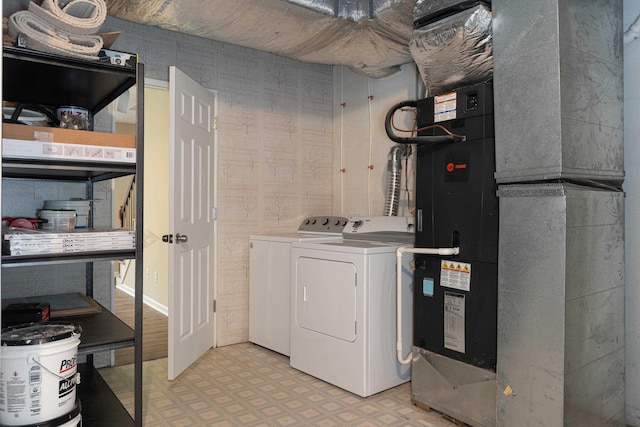 640 Greenwood St, Rockingham, VA 22801 - laundry room with washer and dryer, light floors, and heating unit