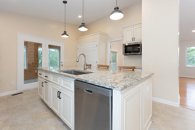 640 Greenwood St, Rockingham, VA 22801 - kitchen featuring appliances with stainless steel finishes, a sink, light stone counters, white cabinets, and decorative light fixtures