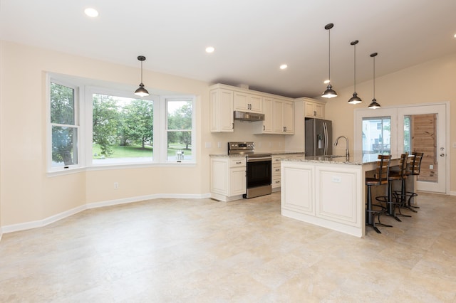 640 Greenwood St, Rockingham, VA 22801 - kitchen with appliances with stainless steel finishes, under cabinet range hood, baseboards, light stone counters, and an island with sink
