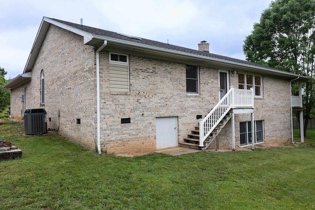 640 Greenwood St, Rockingham, VA 22801 - rear view of property featuring a chimney, central AC, brick siding, and a yard