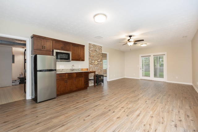 640 Greenwood St, Rockingham, VA 22801 - kitchen with stainless steel appliances, a ceiling fan, light wood finished floors, and a sink
