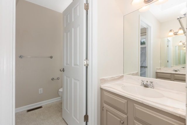 640 Greenwood St, Rockingham, VA 22801 - bathroom with vanity, toilet, and baseboards