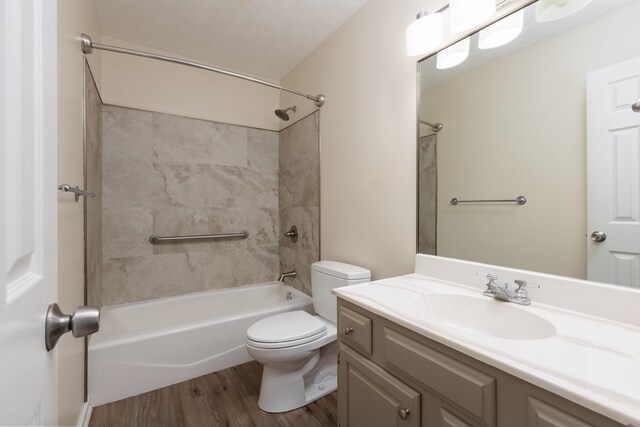 640 Greenwood St, Rockingham, VA 22801 - full bath featuring toilet, wood finished floors, vanity, and shower / bath combination