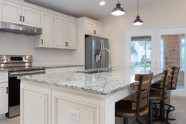 640 Greenwood St, Rockingham, VA 22801 - kitchen with under cabinet range hood, stainless steel appliances, a sink, a center island with sink, and light stone countertops