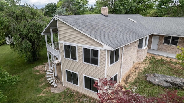 640 Greenwood St, Rockingham, VA 22801 - back of house with stairway, a chimney, a lawn, brick siding, and roof with shingles