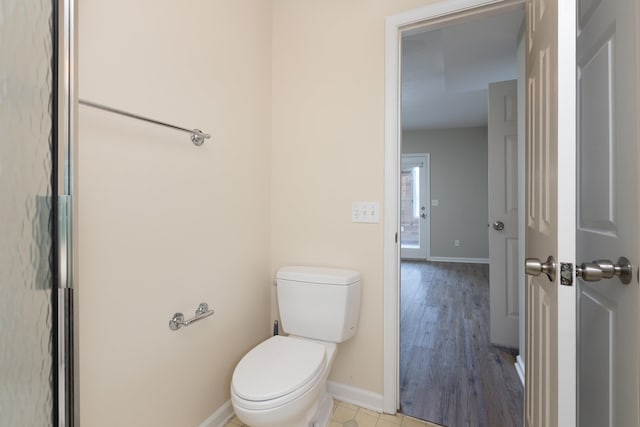 640 Greenwood St, Rockingham, VA 22801 - bathroom featuring baseboards, toilet, and wood finished floors