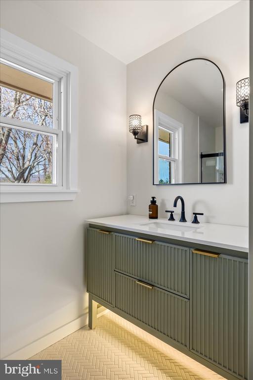 bathroom with baseboards and vanity