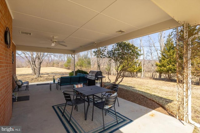 view of patio / terrace with visible vents, ceiling fan, outdoor dining area, and grilling area