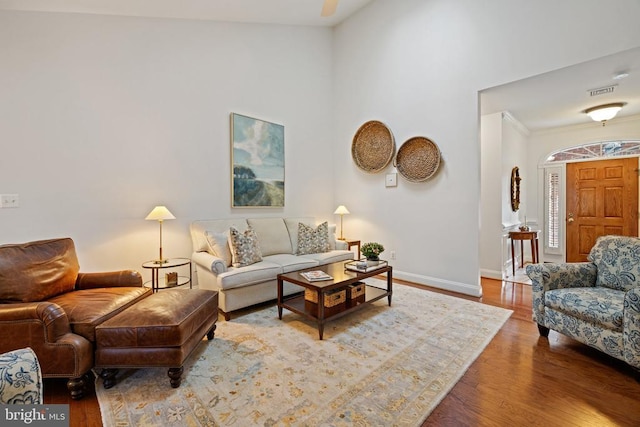 230 Carriage Chase Cir, Warrenton, VA 20186 - living room with wood finished floors, baseboards, and high vaulted ceiling