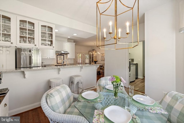 230 Carriage Chase Cir, Warrenton, VA 20186 - dining space with a chandelier, wood finished floors, recessed lighting, and baseboards