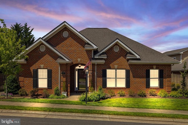 230 Carriage Chase Cir, Warrenton, VA 20186 - traditional home featuring brick siding, a front lawn, and a shingled roof