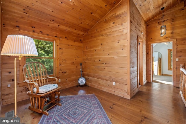 47 Gore Rd, Castleton, VA 22716 - sitting room with vaulted ceiling, hardwood / wood-style floors, wood walls, arched walkways, and wood ceiling