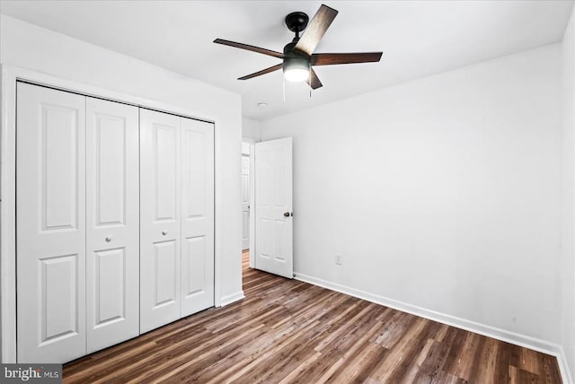 65 Wades Run, Mineral, VA 23117 - unfurnished bedroom featuring dark wood-style floors, baseboards, a closet, and ceiling fan